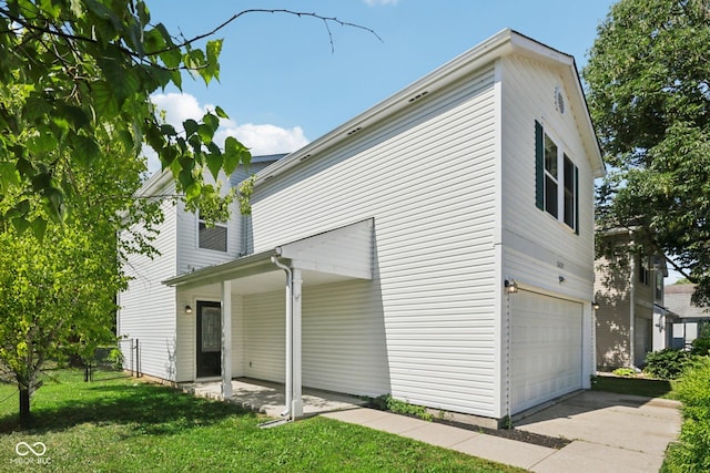 2629 Redland Ln, Indianapolis, IN 46217 - view of property exterior featuring a garage and concrete driveway