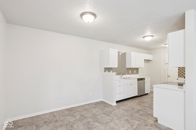 2629 Redland Ln, Indianapolis, IN 46217 - kitchen featuring dishwasher, decorative backsplash, light countertops, white cabinetry, and a textured ceiling