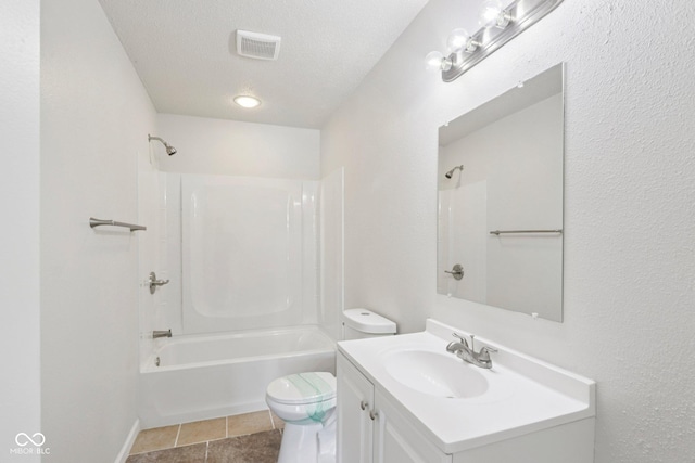 2629 Redland Ln, Indianapolis, IN 46217 - bathroom featuring vanity, bathing tub / shower combination, tile patterned floors, and a textured ceiling