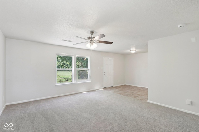 2629 Redland Ln, Indianapolis, IN 46217 - carpeted empty room with ceiling fan, a smoke detector, and a textured ceiling