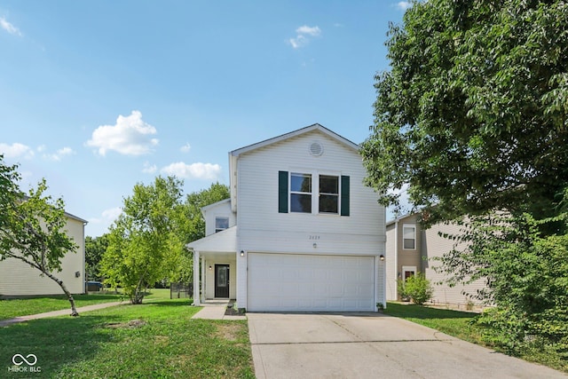 2629 Redland Ln, Indianapolis, IN 46217 - traditional home with driveway, a garage, and a front yard
