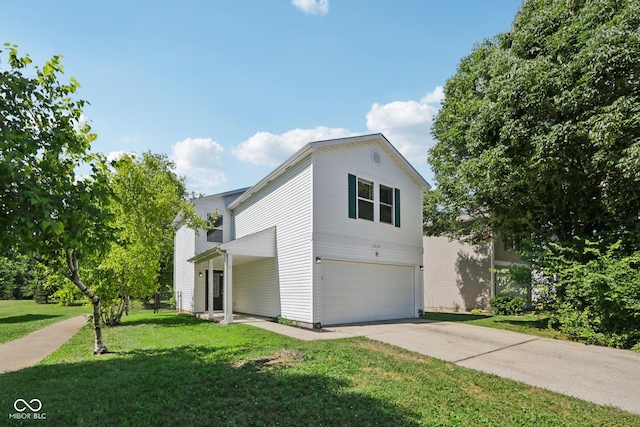 2629 Redland Ln, Indianapolis, IN 46217 - view of side of home with a garage, a lawn, and concrete driveway
