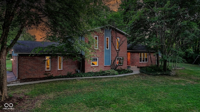 812 Eaglewood Dr, Zionsville, IN 46077 - view of front of home with brick siding and a front lawn