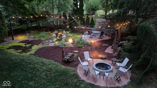 812 Eaglewood Dr, Zionsville, IN 46077 - view of grassy yard with an outdoor fire pit and a patio