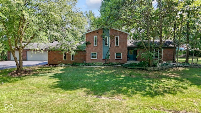 812 Eaglewood Dr, Zionsville, IN 46077 - view of front of property with brick siding, a garage, driveway, and a front yard