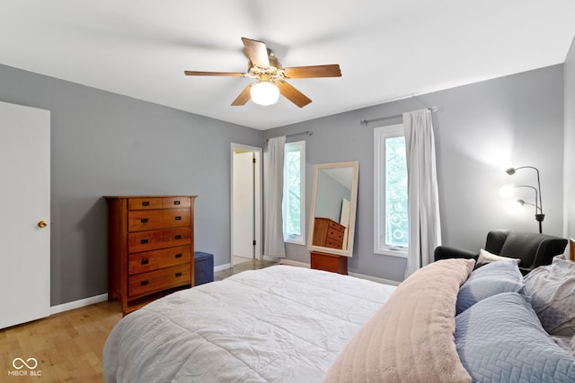 812 Eaglewood Dr, Zionsville, IN 46077 - bedroom with light wood finished floors and a ceiling fan