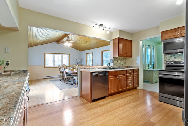812 Eaglewood Dr, Zionsville, IN 46077 - kitchen with stainless steel appliances, light wood finished floors, brown cabinets, and decorative backsplash