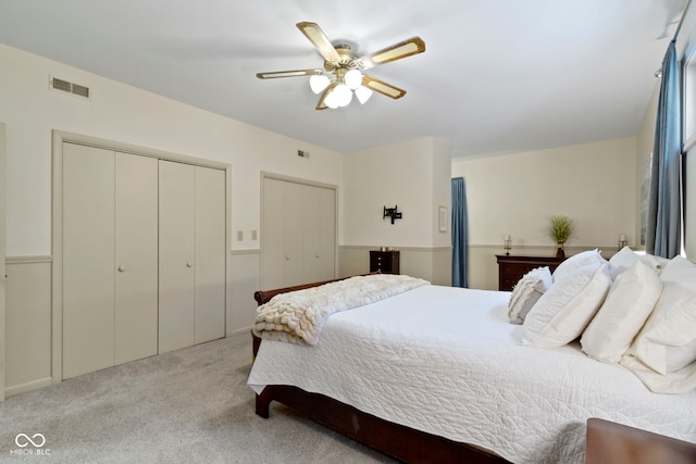 812 Eaglewood Dr, Zionsville, IN 46077 - bedroom with multiple closets, carpet, and a ceiling fan