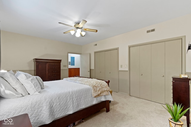 812 Eaglewood Dr, Zionsville, IN 46077 - bedroom with multiple closets, light colored carpet, and a ceiling fan
