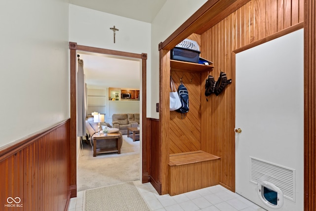 812 Eaglewood Dr, Zionsville, IN 46077 - mudroom featuring a wainscoted wall, wood walls, and light carpet