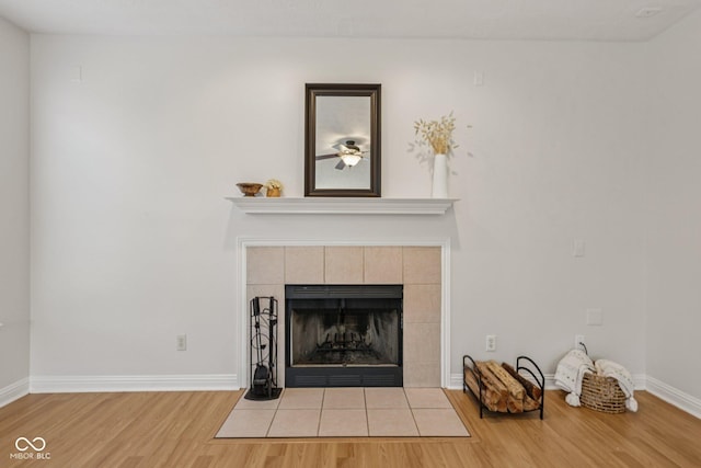 1272 Townsend Dr, Greenwood, IN 46143 - detailed view of wood finished floors, a tile fireplace, and ceiling fan