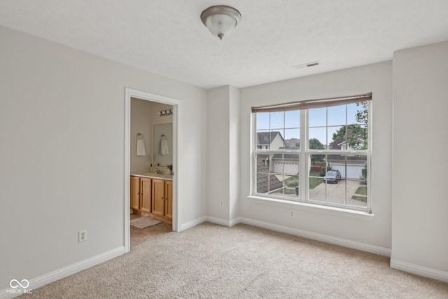 1272 Townsend Dr, Greenwood, IN 46143 - unfurnished bedroom featuring light colored carpet and ensuite bathroom