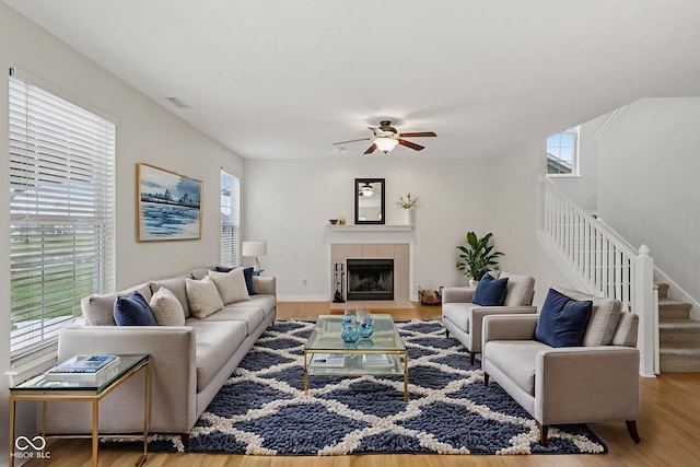 1272 Townsend Dr, Greenwood, IN 46143 - living area featuring stairs, healthy amount of natural light, wood finished floors, and a ceiling fan