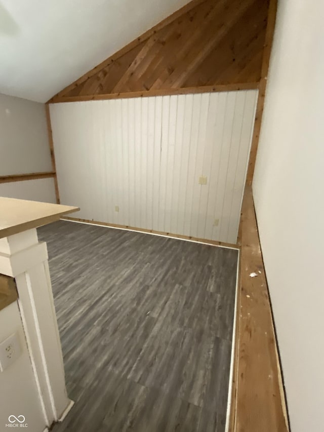 3170 Sapphire Blvd, Indianapolis, IN 46268 - unfurnished living room featuring wood finished floors, lofted ceiling, and wooden walls