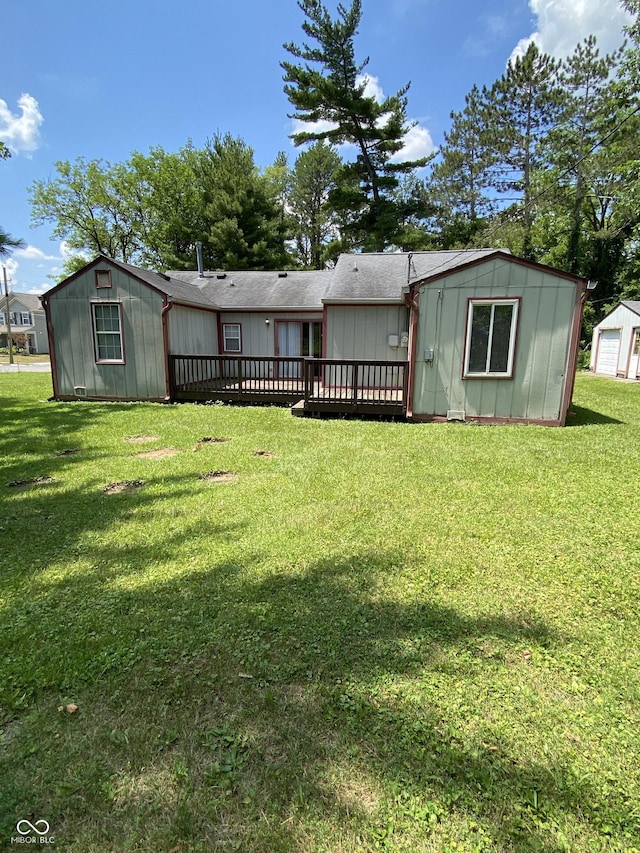 3170 Sapphire Blvd, Indianapolis, IN 46268 - back of house with board and batten siding, a wooden deck, a yard, and a shingled roof