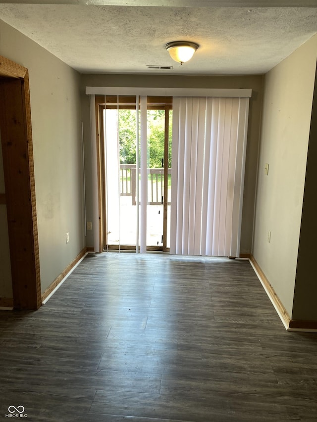 3170 Sapphire Blvd, Indianapolis, IN 46268 - empty room featuring dark wood finished floors and a textured ceiling