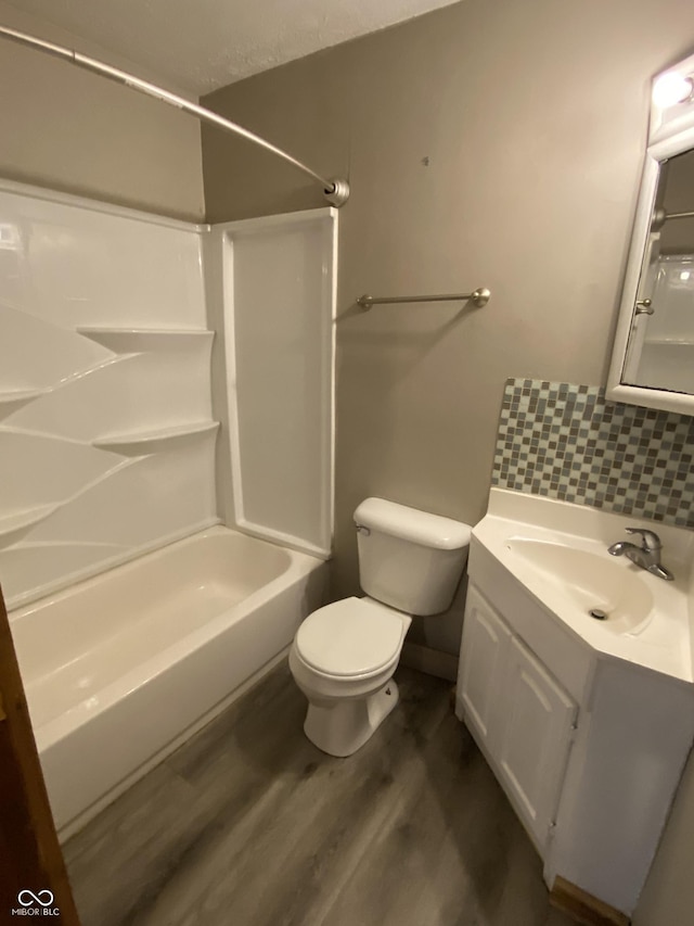 3170 Sapphire Blvd, Indianapolis, IN 46268 - bathroom featuring  shower combination, wood finished floors, vanity, and tasteful backsplash