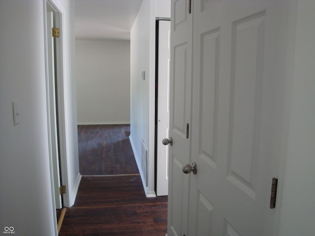 3448 Georgetown Rd, Indianapolis, IN 46224 - corridor with dark wood finished floors and baseboards