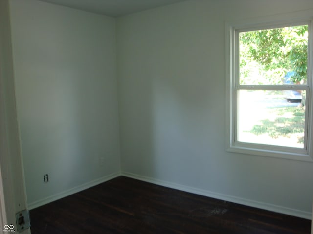 3448 Georgetown Rd, Indianapolis, IN 46224 - unfurnished room featuring dark wood-style floors and baseboards