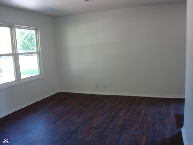3448 Georgetown Rd, Indianapolis, IN 46224 - spare room featuring dark wood-style flooring and plenty of natural light
