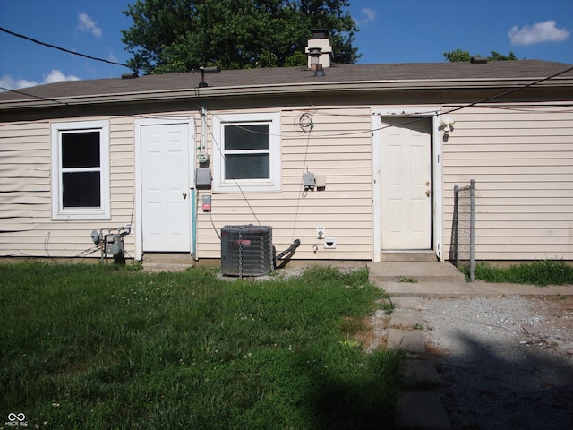 3448 Georgetown Rd, Indianapolis, IN 46224 - rear view of property with a chimney and a lawn