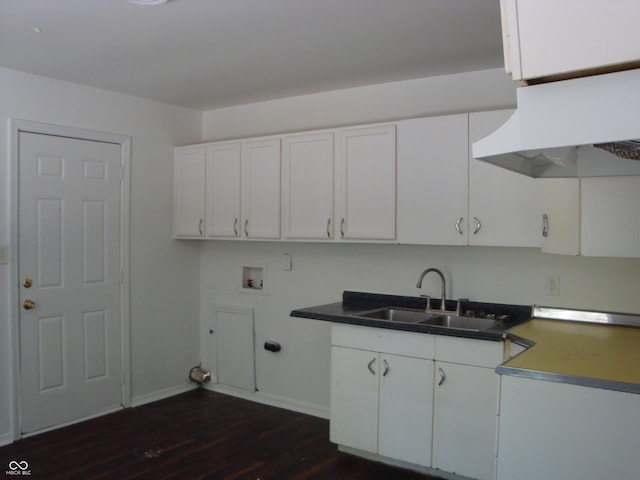 3448 Georgetown Rd, Indianapolis, IN 46224 - laundry area featuring washer hookup, dark wood-style floors, and cabinet space