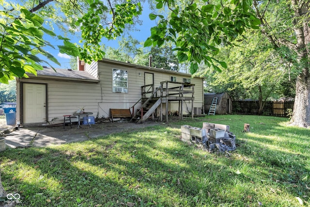 3909 Richelieu Ct, Indianapolis, IN 46226 - rear view of house with a storage shed, stairway, a fenced backyard, a wooden deck, and a chimney