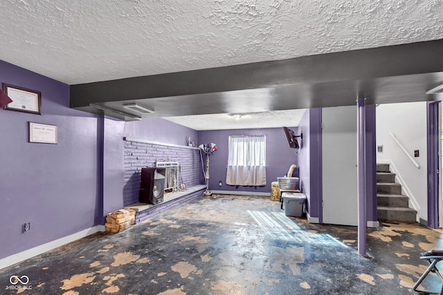 3909 Richelieu Ct, Indianapolis, IN 46226 - below grade area with a textured ceiling, stairs, and a wood stove