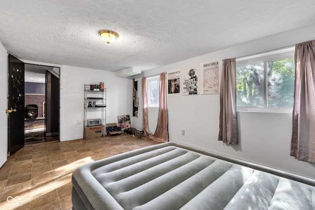 3909 Richelieu Ct, Indianapolis, IN 46226 - bedroom with a textured ceiling and baseboards