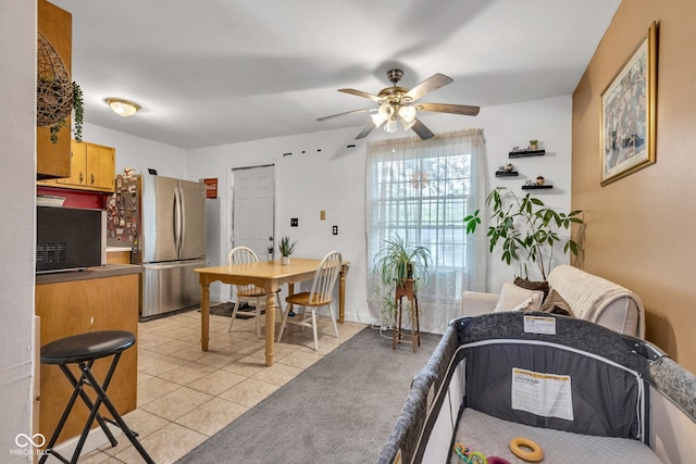 3909 Richelieu Ct, Indianapolis, IN 46226 - dining area with a ceiling fan and light tile patterned floors