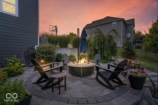 11322 Sea Side Ct, Fishers, IN 46040 - patio terrace at dusk with an outdoor fire pit and a patio area