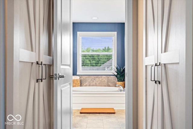 11322 Sea Side Ct, Fishers, IN 46040 - bathroom featuring a bath and tile patterned flooring