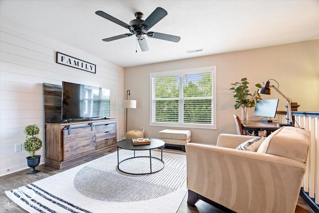 11322 Sea Side Ct, Fishers, IN 46040 - living room with dark wood-type flooring, wooden walls, and ceiling fan