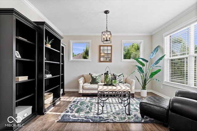 11322 Sea Side Ct, Fishers, IN 46040 - sitting room featuring a chandelier, wood finished floors, and crown molding