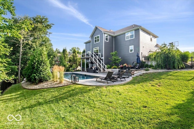 11322 Sea Side Ct, Fishers, IN 46040 - back of house featuring stairway, a patio, an outdoor pool, and a wooden deck