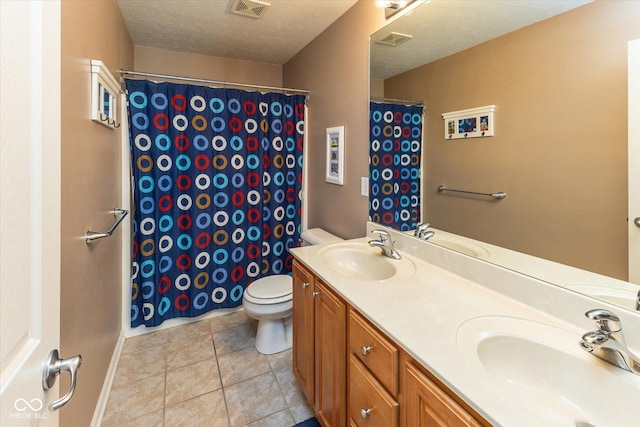 13059 Cirrus Dr, Fishers, IN 46037 - full bathroom with double vanity, tile patterned floors, curtained shower, and a textured ceiling