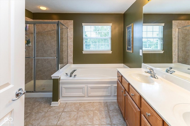 13059 Cirrus Dr, Fishers, IN 46037 - bathroom featuring plenty of natural light, double vanity, a garden tub, and a stall shower