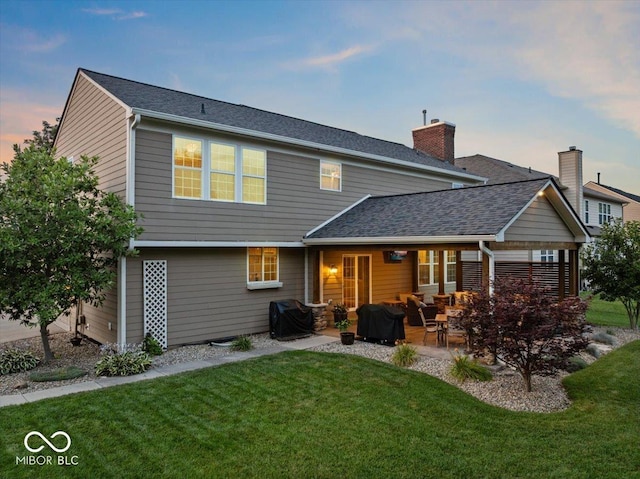 13059 Cirrus Dr, Fishers, IN 46037 - back of property featuring a patio area, a yard, outdoor lounge area, and a shingled roof
