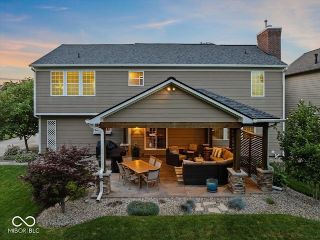 13059 Cirrus Dr, Fishers, IN 46037 - back of house featuring an outdoor hangout area, a patio, roof with shingles, a chimney, and a yard