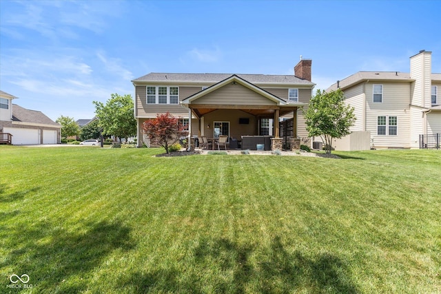 13059 Cirrus Dr, Fishers, IN 46037 - rear view of property with a yard, a patio area, an outdoor hangout area, and a chimney