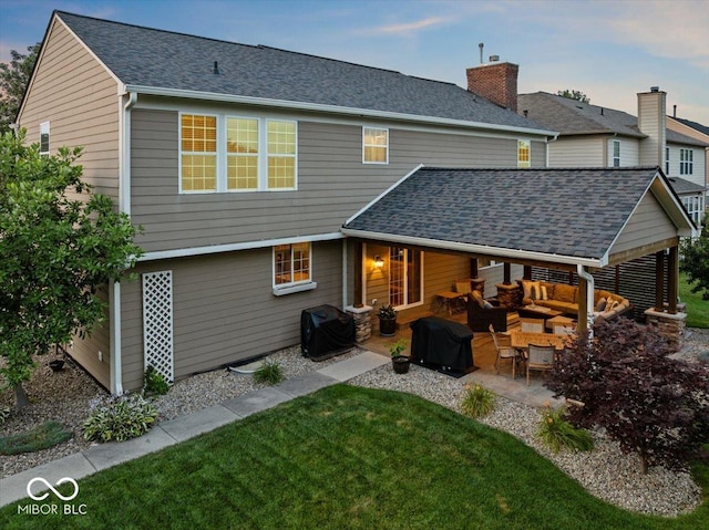 13059 Cirrus Dr, Fishers, IN 46037 - back of house featuring a patio area, an outdoor hangout area, a lawn, and roof with shingles