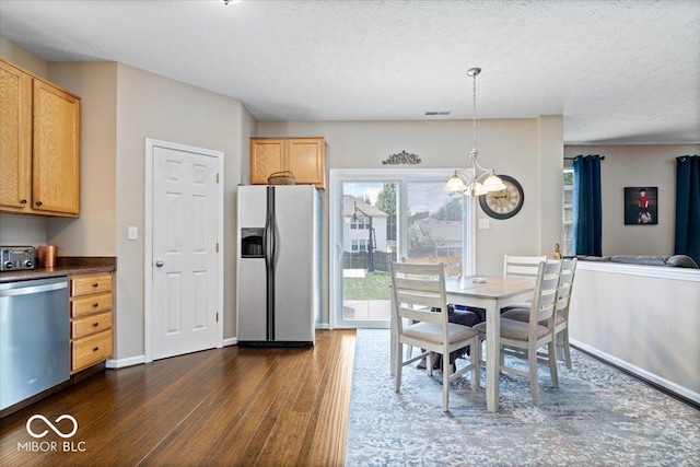16009 Tenor Way, Noblesville, IN 46060 - dining space featuring dark wood-style flooring, a chandelier, and a textured ceiling