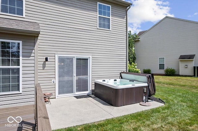 16009 Tenor Way, Noblesville, IN 46060 - back of property featuring a hot tub, a lawn, and a patio