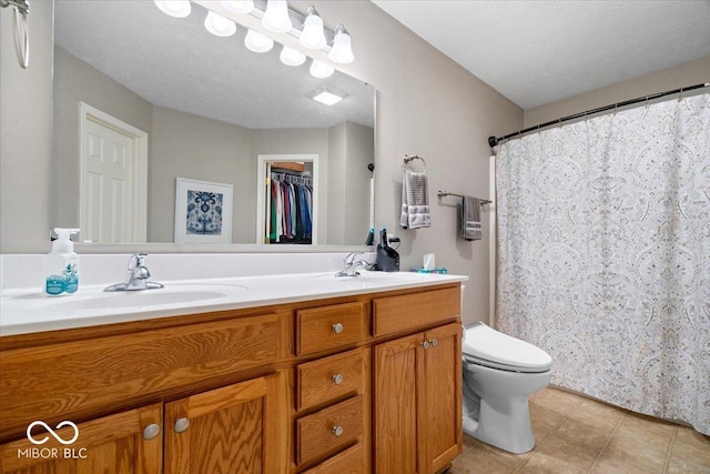 16009 Tenor Way, Noblesville, IN 46060 - full bathroom featuring double vanity, tile patterned flooring, a textured ceiling, a shower with shower curtain, and a spacious closet