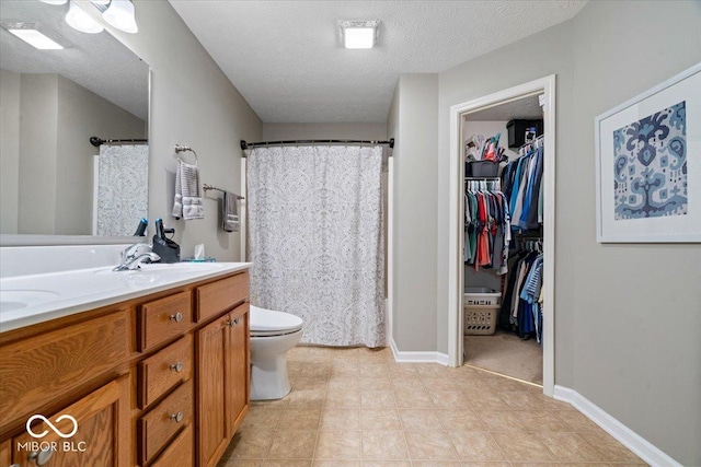 16009 Tenor Way, Noblesville, IN 46060 - full bath with double vanity, a shower with shower curtain, a textured ceiling, and a spacious closet
