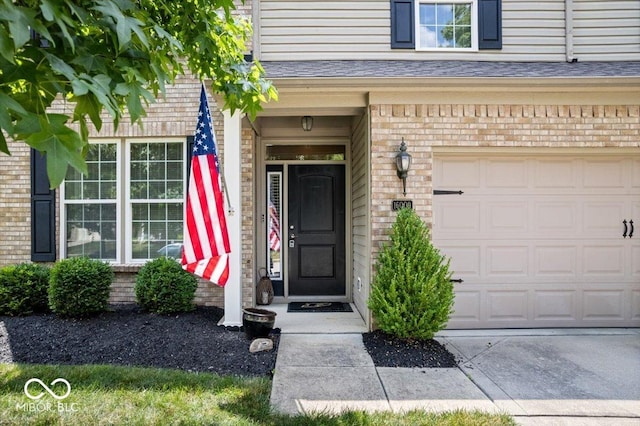 16009 Tenor Way, Noblesville, IN 46060 - property entrance featuring a garage and brick siding