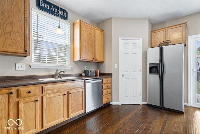 16009 Tenor Way, Noblesville, IN 46060 - kitchen featuring stainless steel appliances, dark countertops, dark wood finished floors, and healthy amount of natural light
