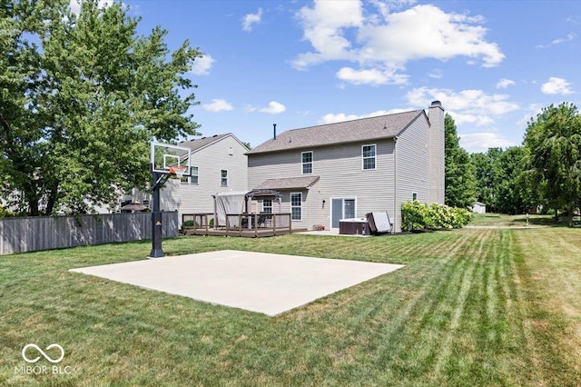16009 Tenor Way, Noblesville, IN 46060 - rear view of house featuring a deck, a chimney, a patio, and basketball court