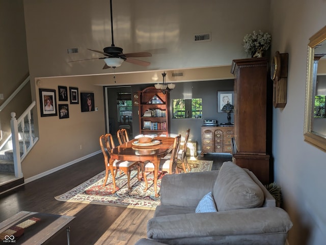 7327 Newbury Ct, Fishers, IN 46038 - dining room with ceiling fan, stairs, and wood finished floors
