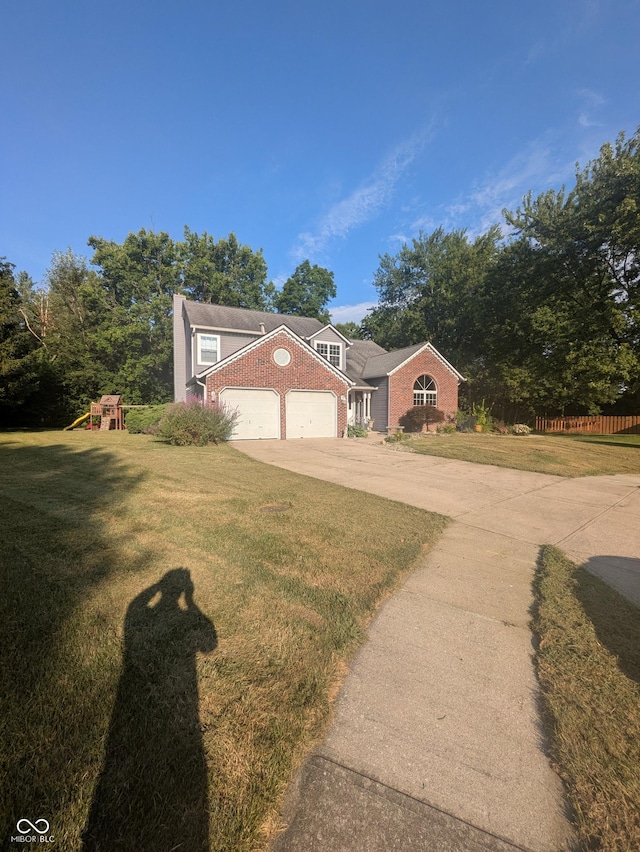 7327 Newbury Ct, Fishers, IN 46038 - traditional home featuring concrete driveway, brick siding, a playground, and an attached garage